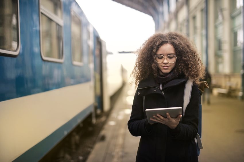 woman-in-black-coat-holding-white-tablet-computer-3772503.jpg